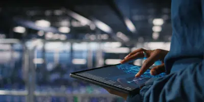 Close Up Data Center Engineer Using Tablet Doing Maintenance Ai Rigs